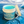 Jar of cool muscle gel with ocean background