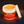 Jar of warm muscle gel with a red label on a dark background